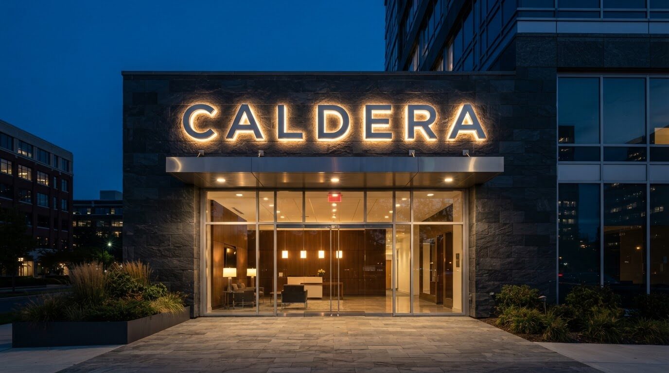 Dual front-lit and halo-lit channel letters on a commercial building entrance at night - ShopSign Houston